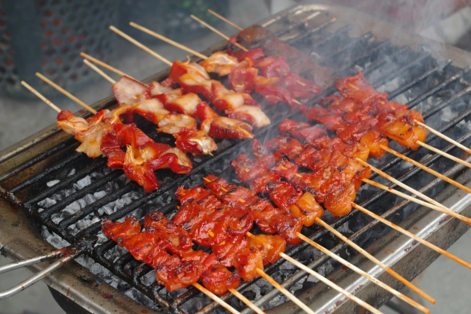 Mouth-watering Chicken skewers are being barbecued on the grill